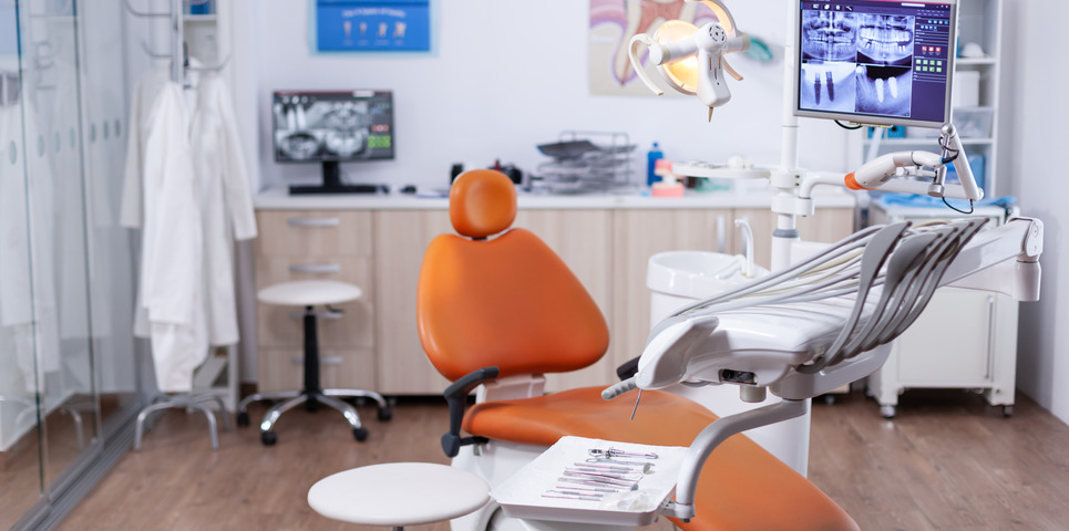 Dentist's office interior with modern chair and special dentisd equipment. The interior of stomatology clinic.